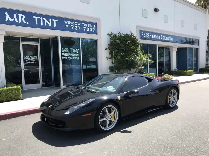 Black Ferrari 458 Italia parked outside the Mr. Tint shop in Norco