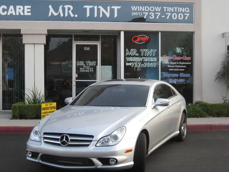 Silver Mercedes CLS outside the Mr. Tint storefront
