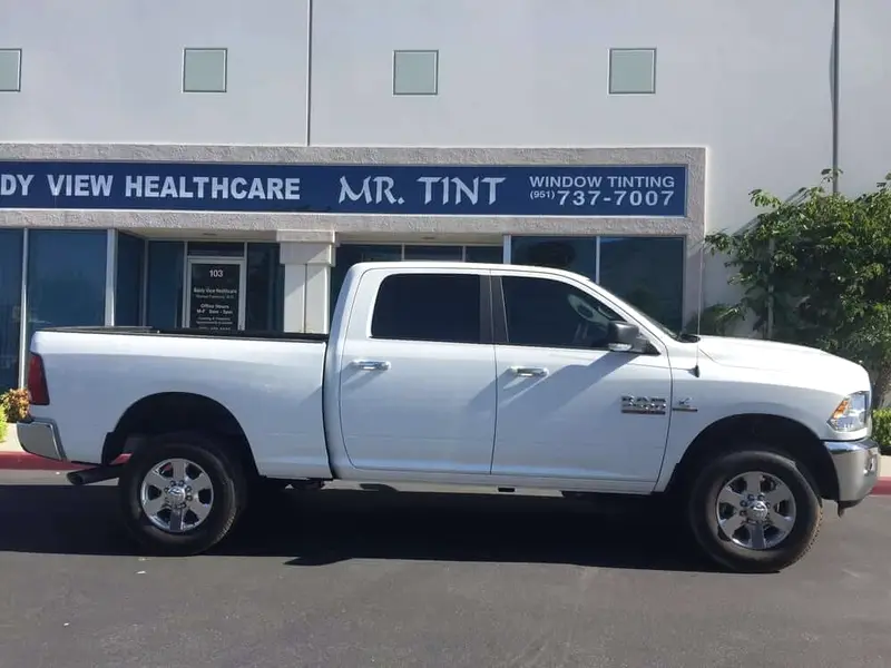 White Ram 2500 pickup outside the Mr. Tint shop