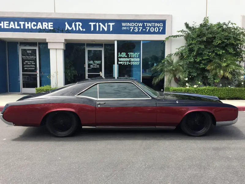 Side view of a classic Buick Riviera with tinted windows