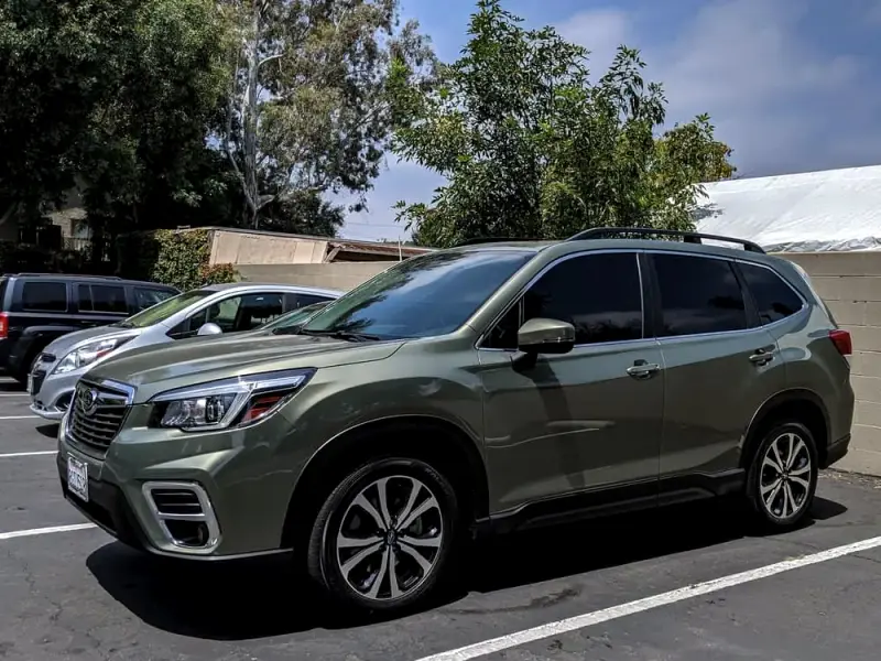 Green Subaru Forester with tinted windows