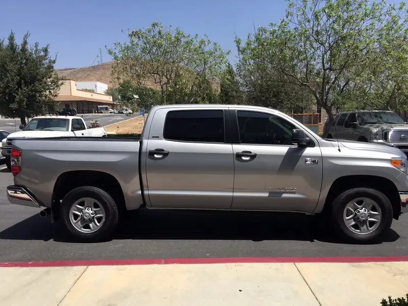 Silver Toyota Tundra pickup with tinted windows